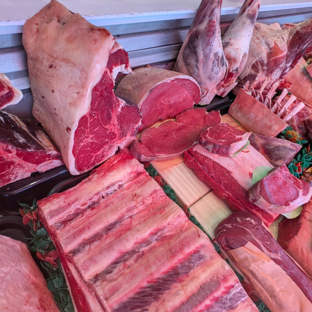 Fresh meat in a butchers window.