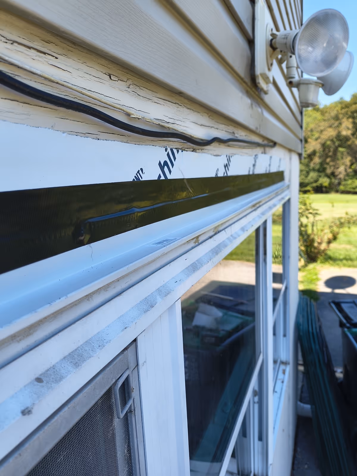 Close-up of a re-flashing an exterior window in Westtown, NY