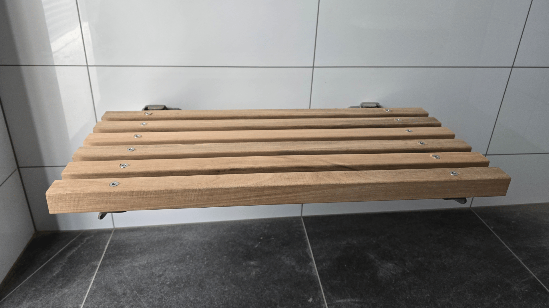 Folding bench seat for inside washrooms