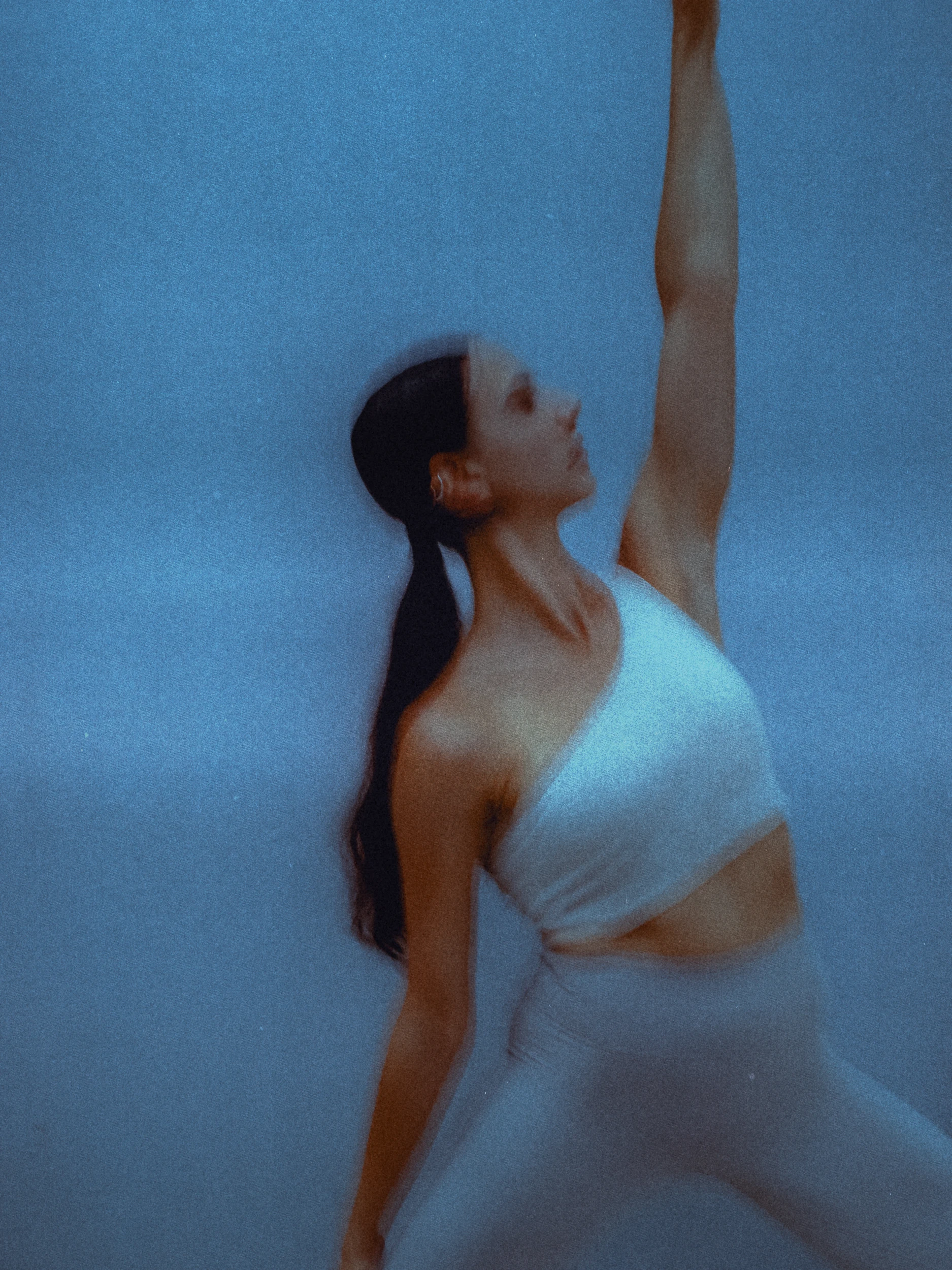 girl in yoga pose shot on analogue