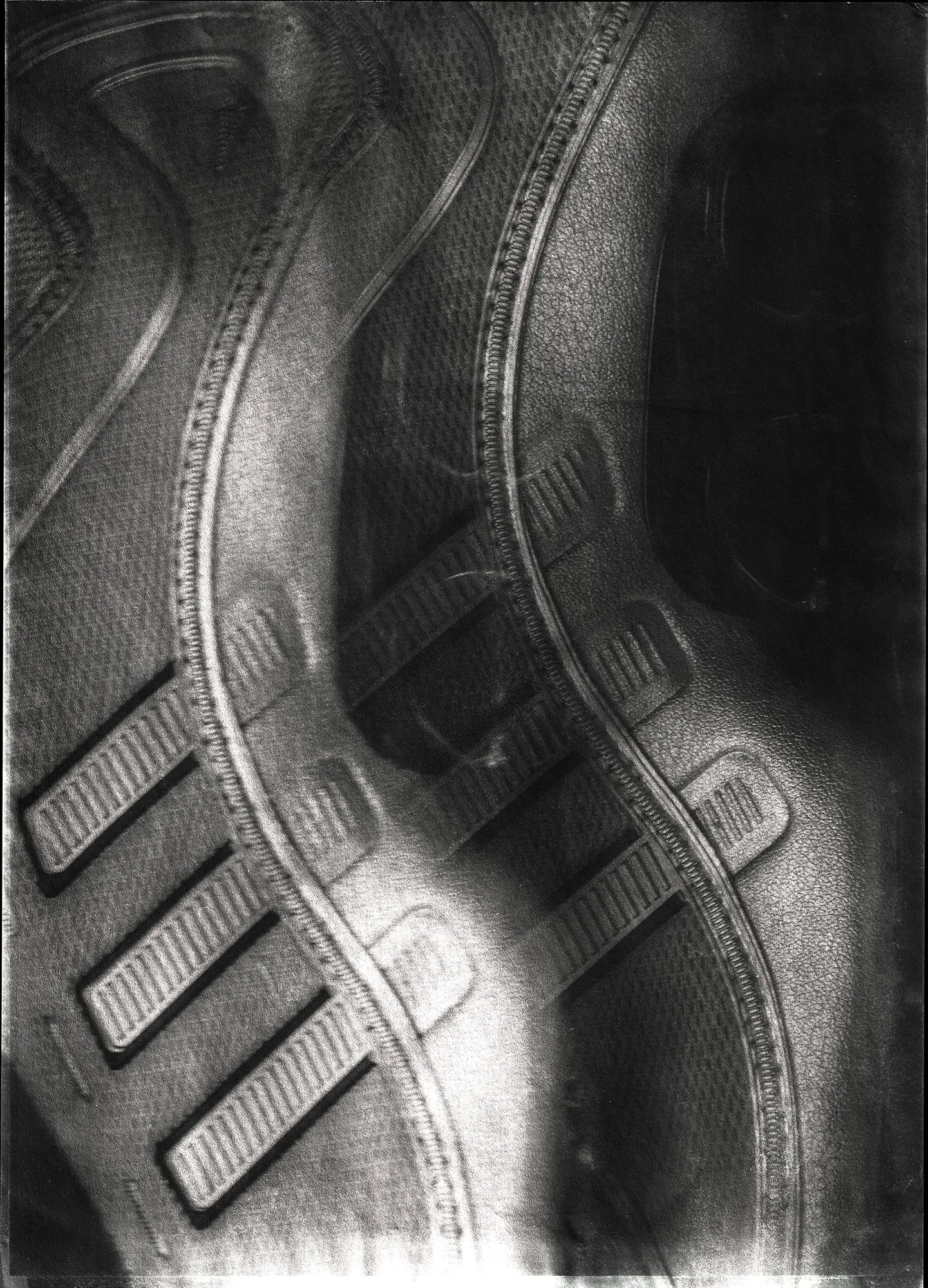 Black-and-white image of an Adidas sneaker Megaride O1 floating against a dark background, surrounded by circular motion blur, with a textured, film-like border that emphasizes speed and energy.