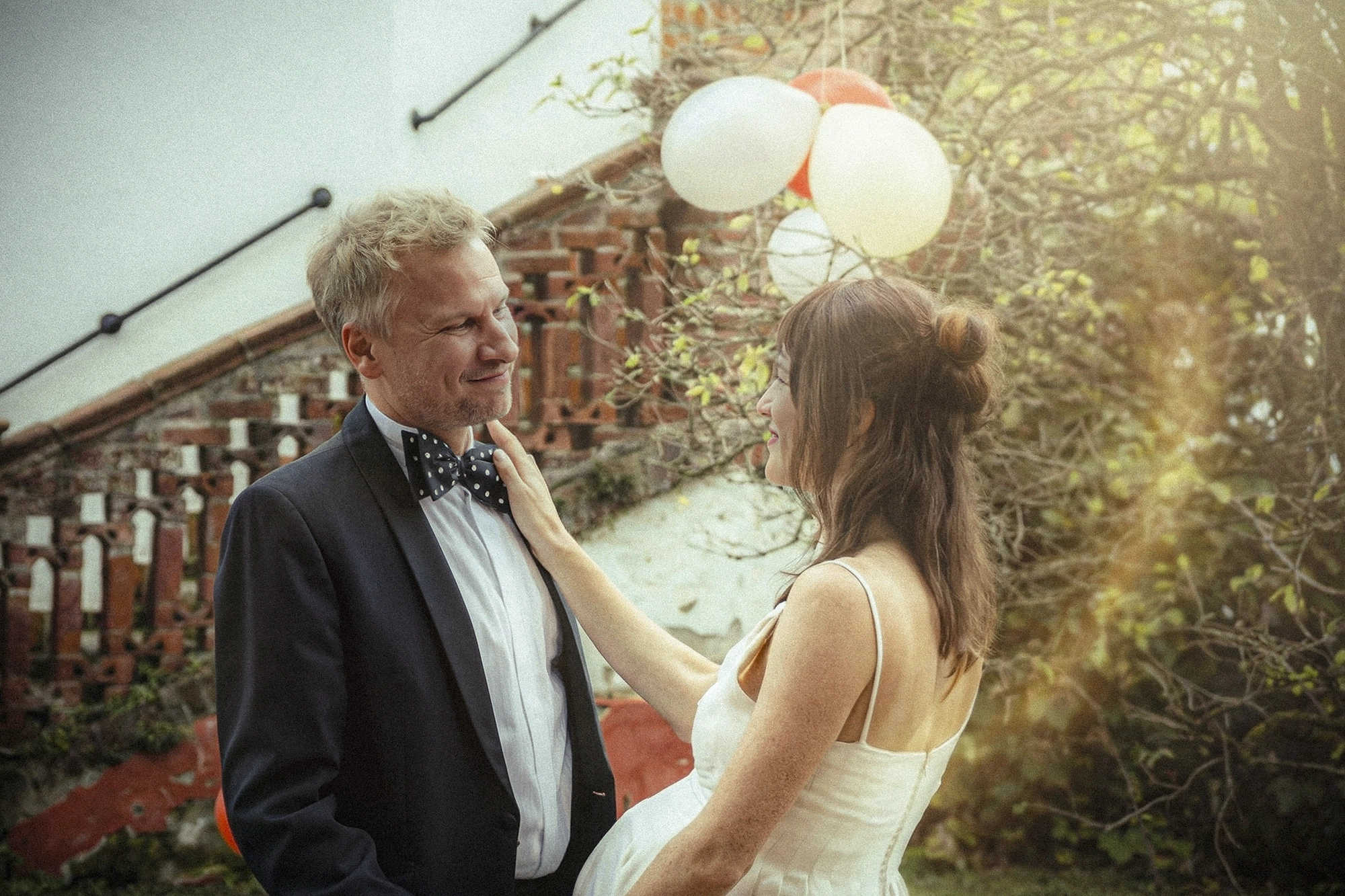 Nikolett Kustos photographed Film Still  from movie Four Minus Three (Vier Minus Drei). A couple at their wedding getting married with a soft light coming from the right side. Actress Valerie Pachner and actor Robert Stadlober.