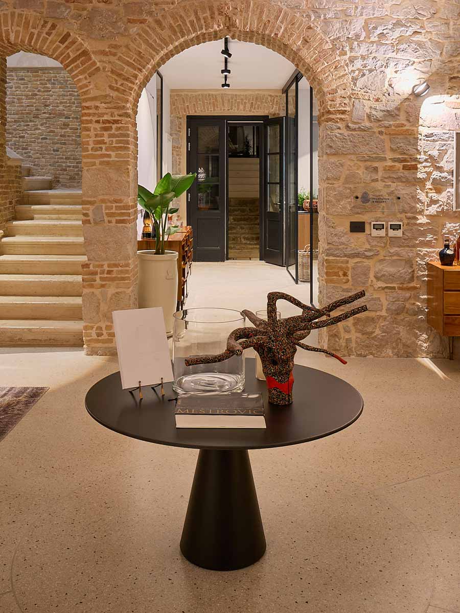 Living room scene with curated design objects and soft, ambient lighting for a sophisticated atmosphere.