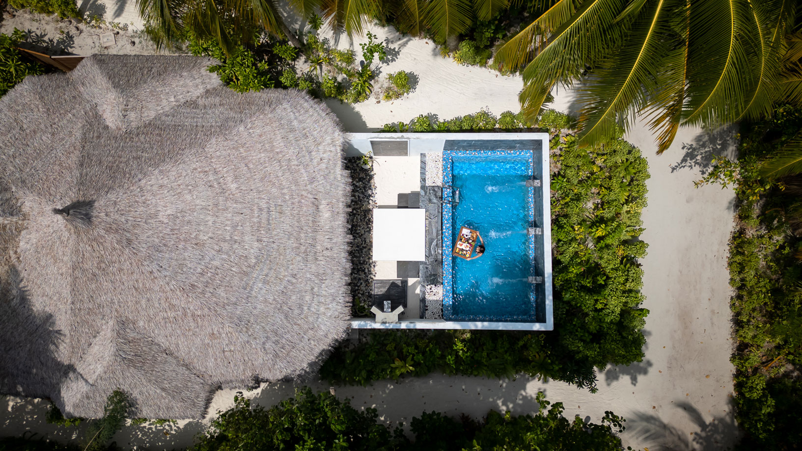 A birds eyed view of one of the luxury Kihaa Villas with outdoor pool