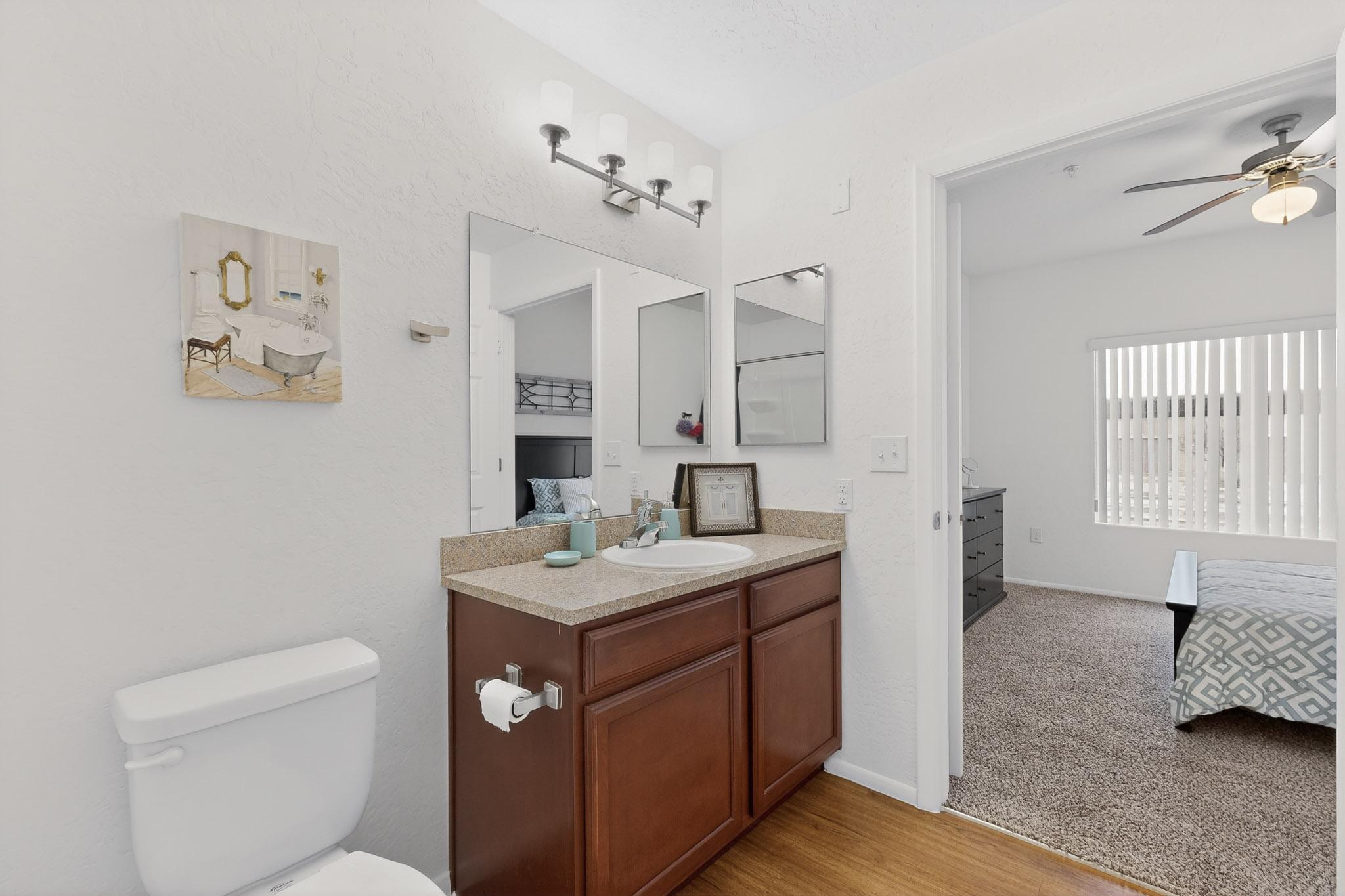 furnished master bedroom with bed and wardrobe