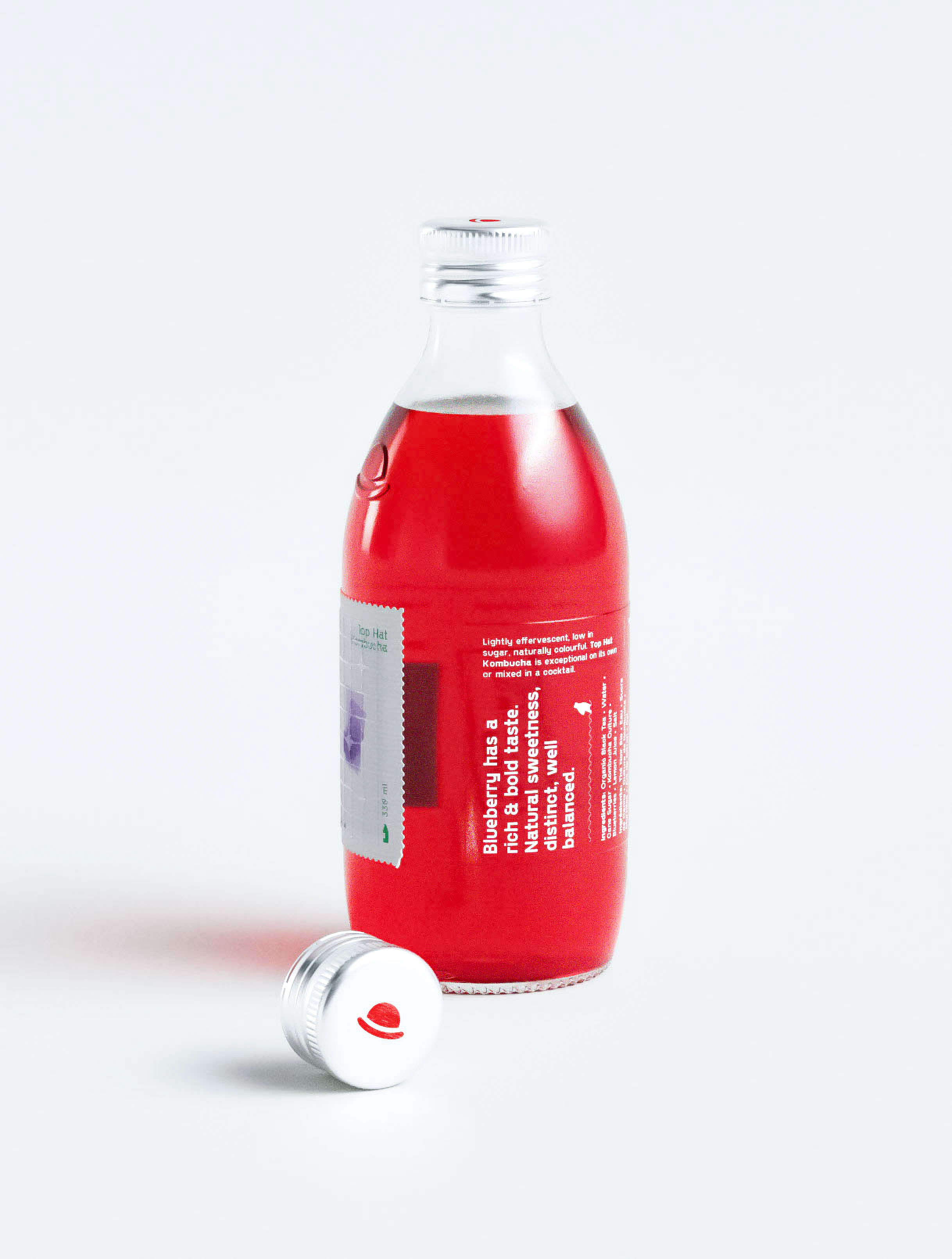 Innovative kombucha packaging design featuring unique postage stamp-style blueberry illustration creating memorable brand differentiation in competitive beverage market. Design studio portfolio piece demonstrating creative use of stamp motif as design element with perforated edges and botanical imagery. Professional packaging design agency execution balancing whimsical visual storytelling with sophisticated typography for artisanal fermented beverage branding.
