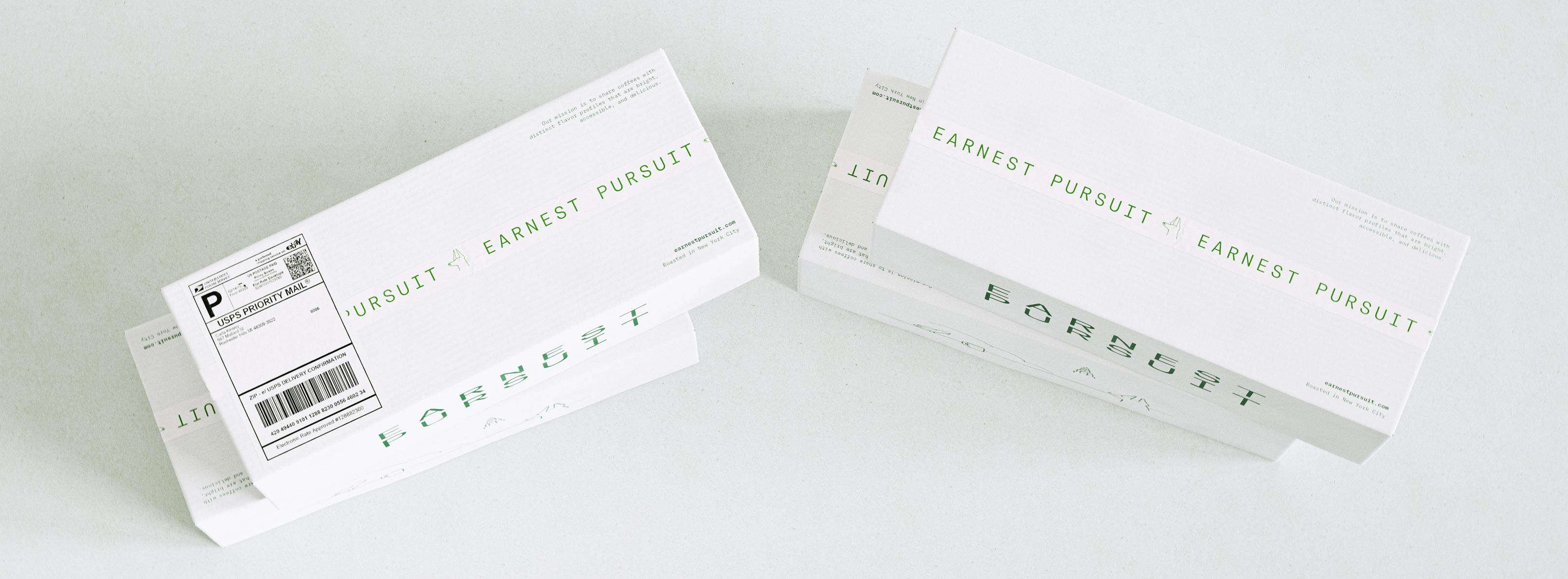 Two slim white mailer boxes lie flat at opposing angles on a pale grey surface, one bearing a USPS Priority Mail label with barcode and delivery confirmation. Across the long faces the forest-green EARNEST PURSUIT wordmark runs in a widely spaced grotesque, mirrored and repeated as a graphic motif, alongside a small mission line and the "Roasted in New York City" credit. The mailers are matte uncoated corrugate printed in a single green ink, engineered as long, low shipping cartons. This is a typography-led, minimalist packaging design — brand identity and print production for the launch of a new mail-order coffee service, built to look considered from warehouse to doorstep.