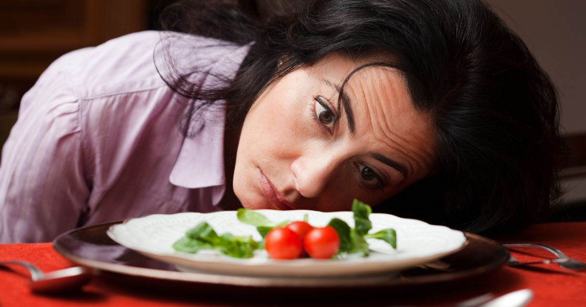 Person eliminating foods from diet