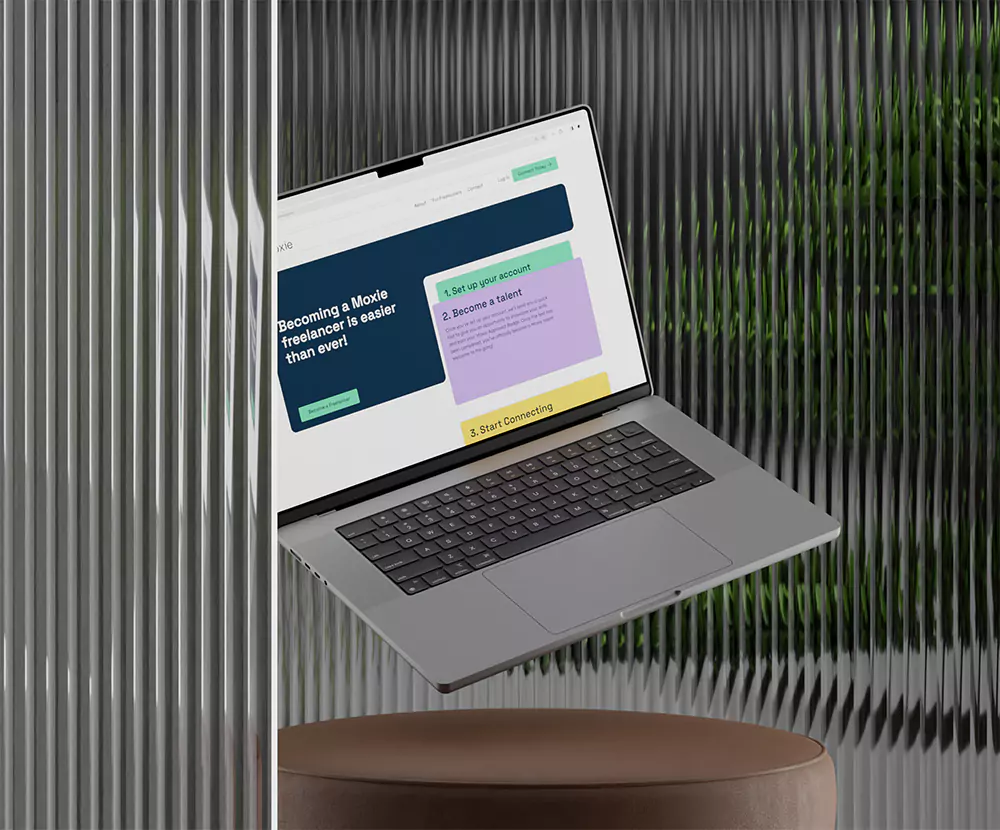 En svävande Macbook bakom en glasvägg.