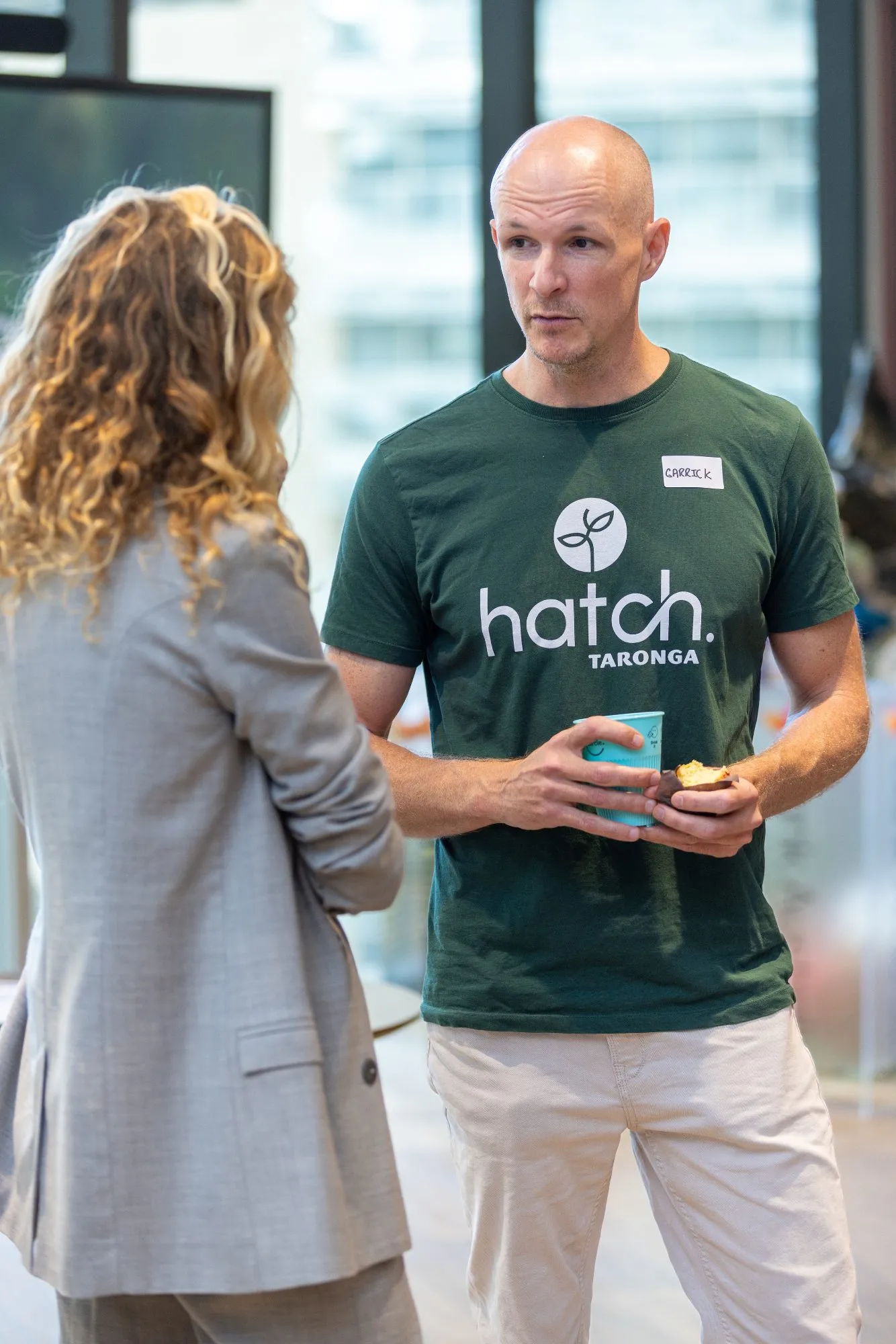 People talking at a CAWSYD networking event