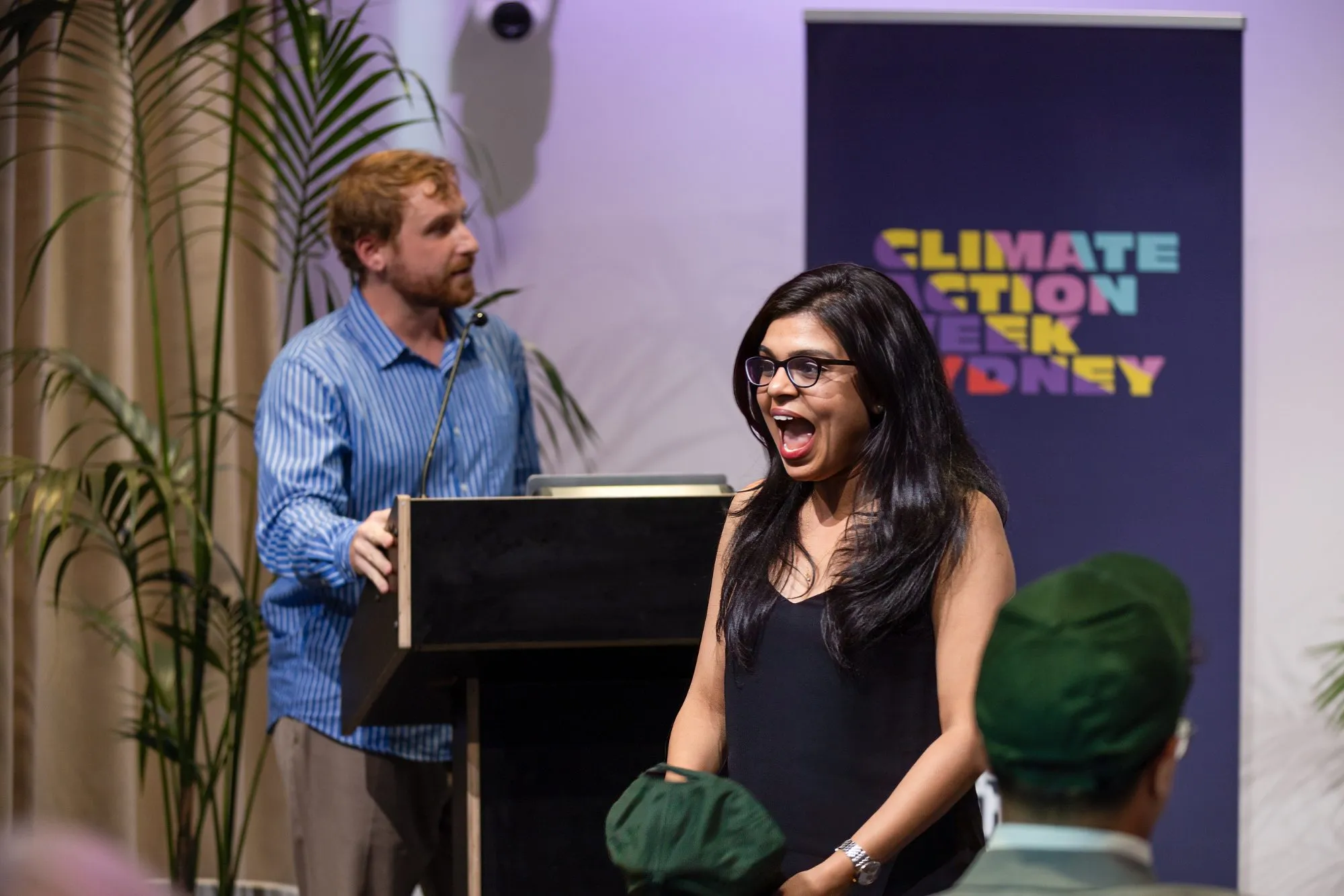 A winner reacting on stage at CAWSYD26