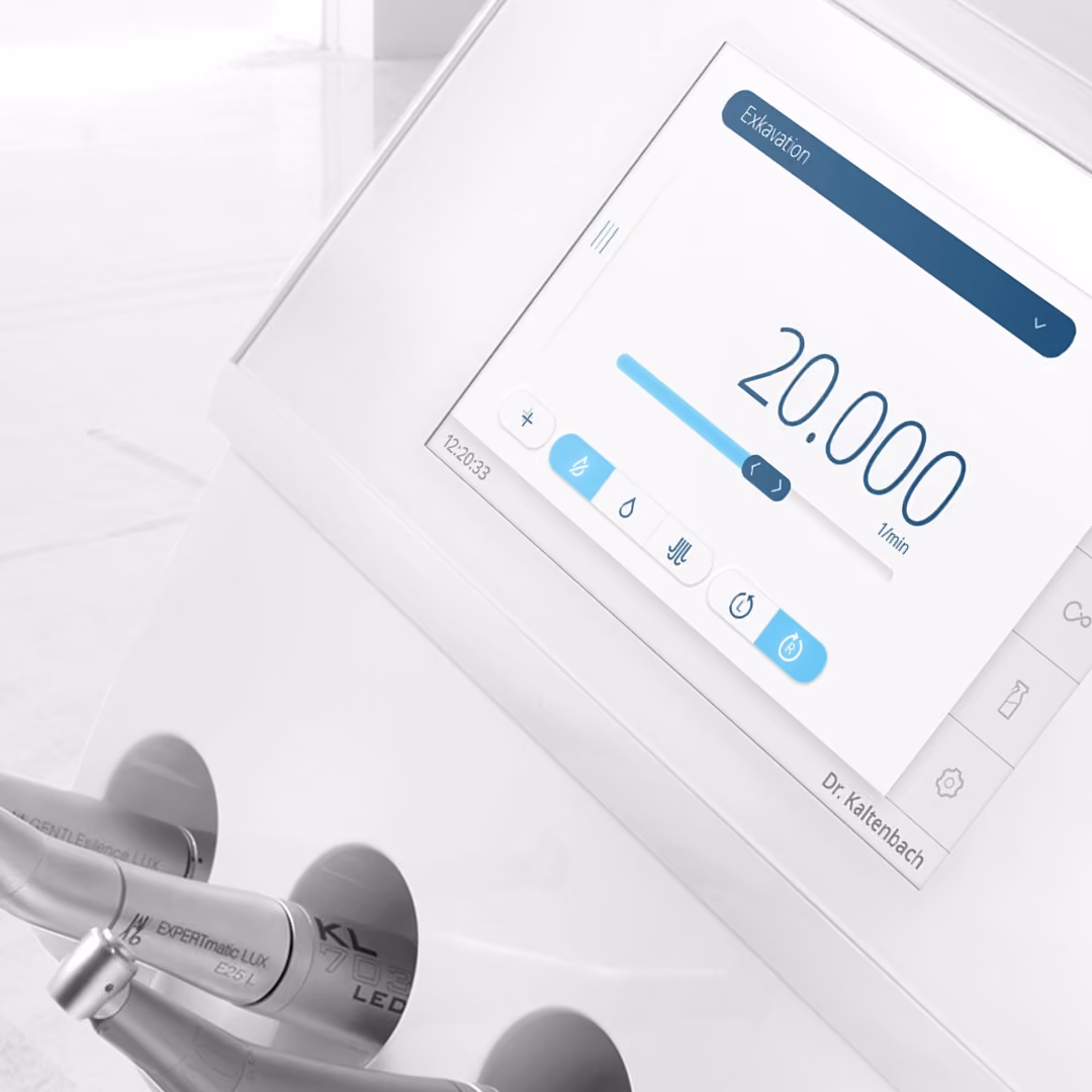 Dental equipment control panel with a screen showing speed set to 20,000 1/min and handpiece attachments.
