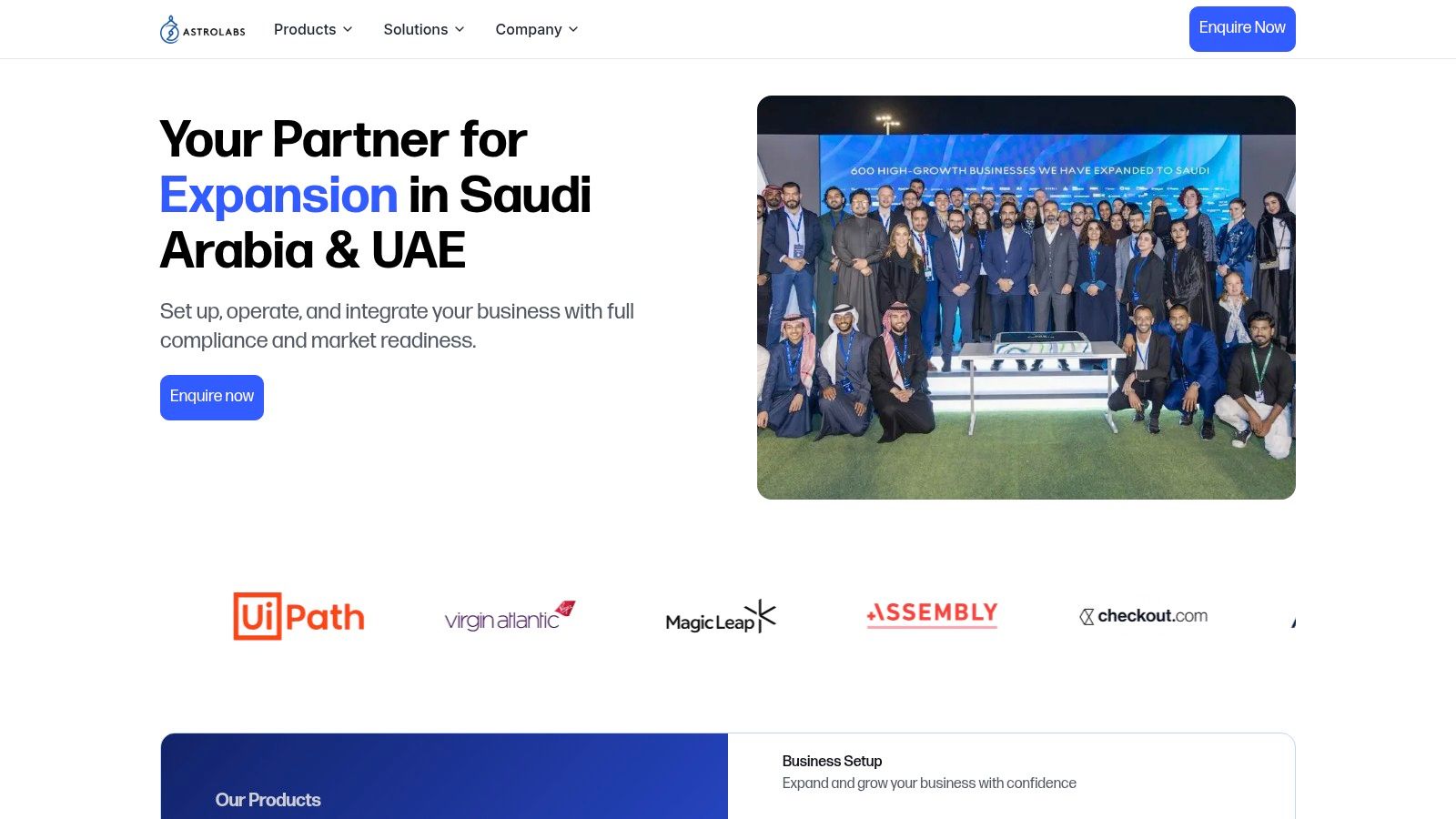 Two professionals in a modern office setting discussing business expansion on a tablet, representing startups for business.