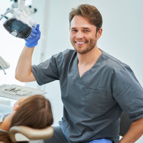 a photo of a dentist attending to a patient