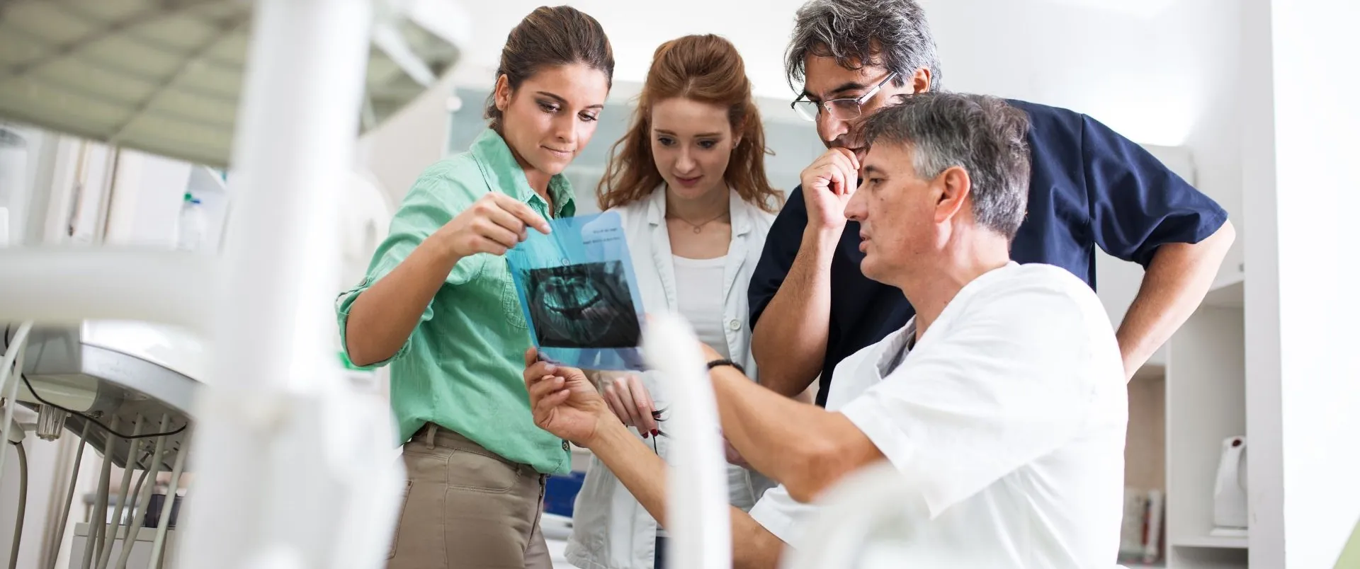 a group of people looking at a x-ray image