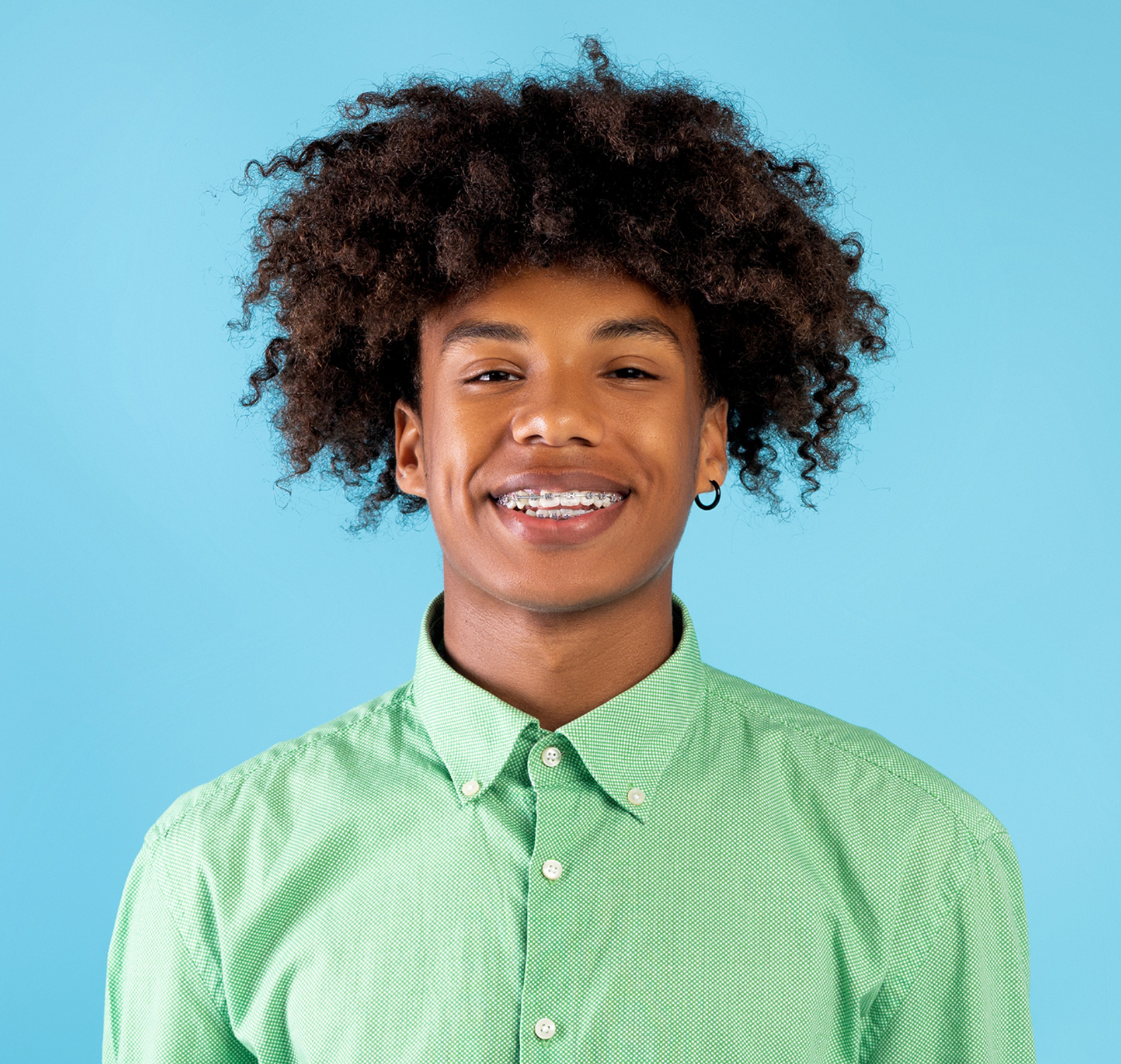 Happy patient smiling with braces