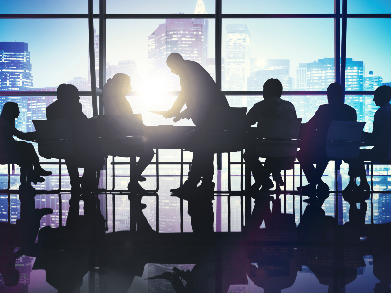 Finance professionals reviewing digital asset accounting data