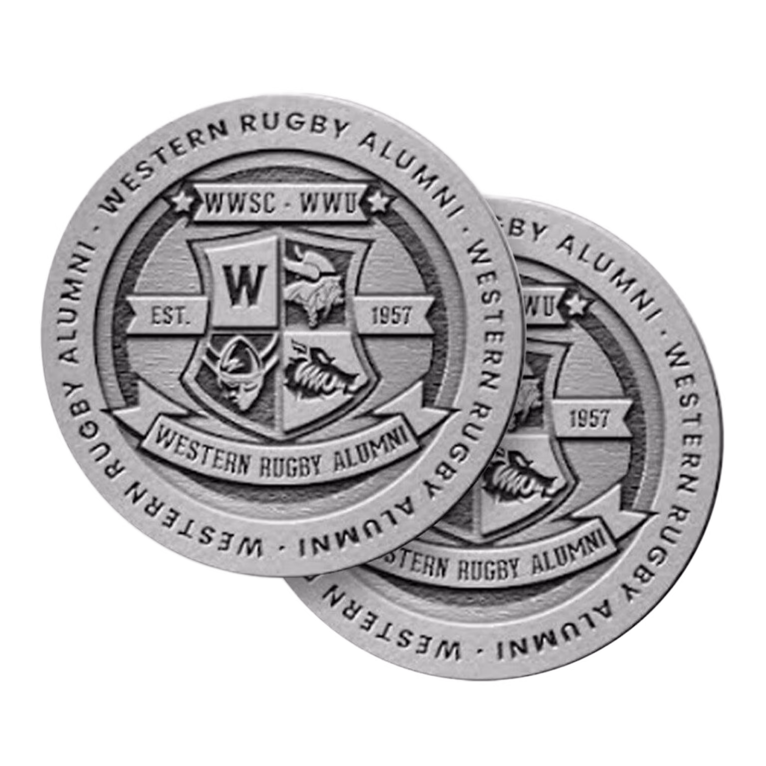 Two overlapping Western Rugby Alumni zinc coins with crest and 'Est. 1957' inscription.