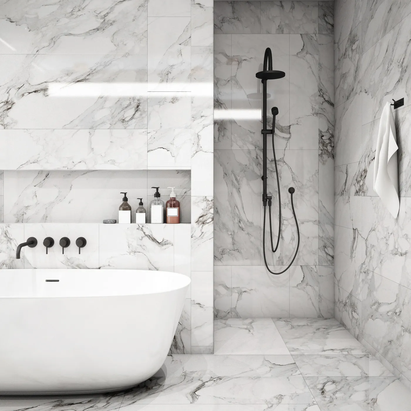 Marble-tile bathroom with a freestanding tub and black shower fixtures
