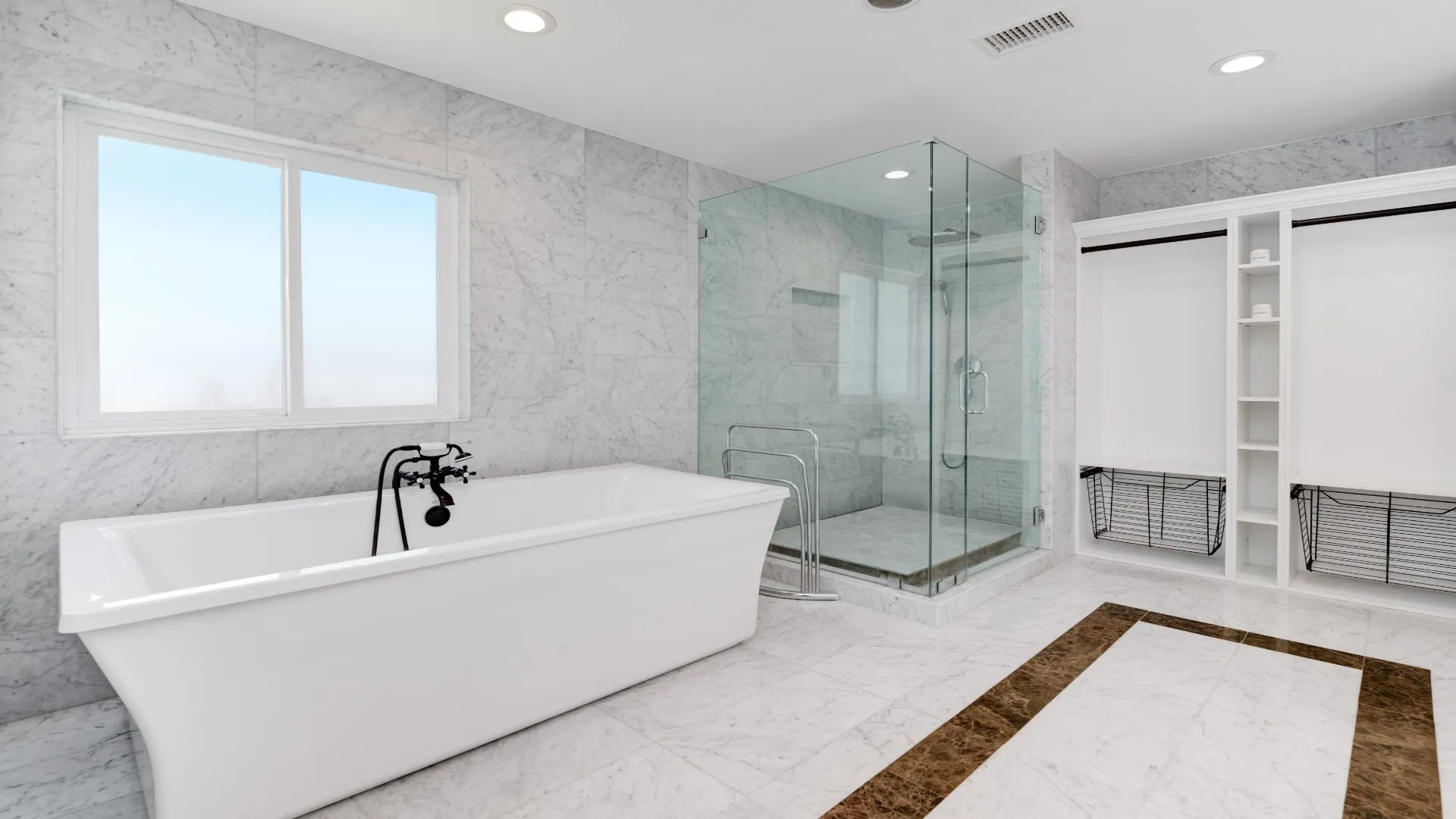 Primary bathroom with a freestanding tub and glass walk-in shower