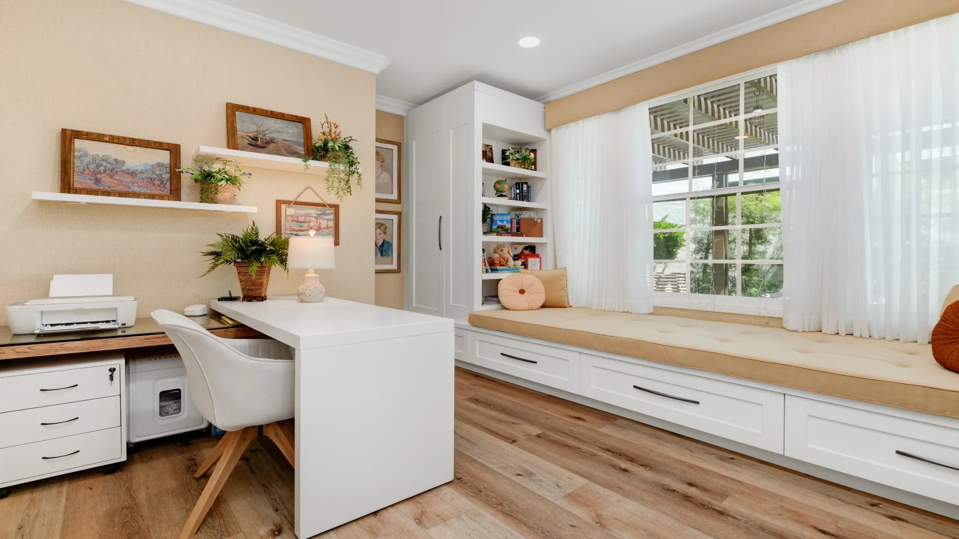 Home office with a built-in desk and window seat