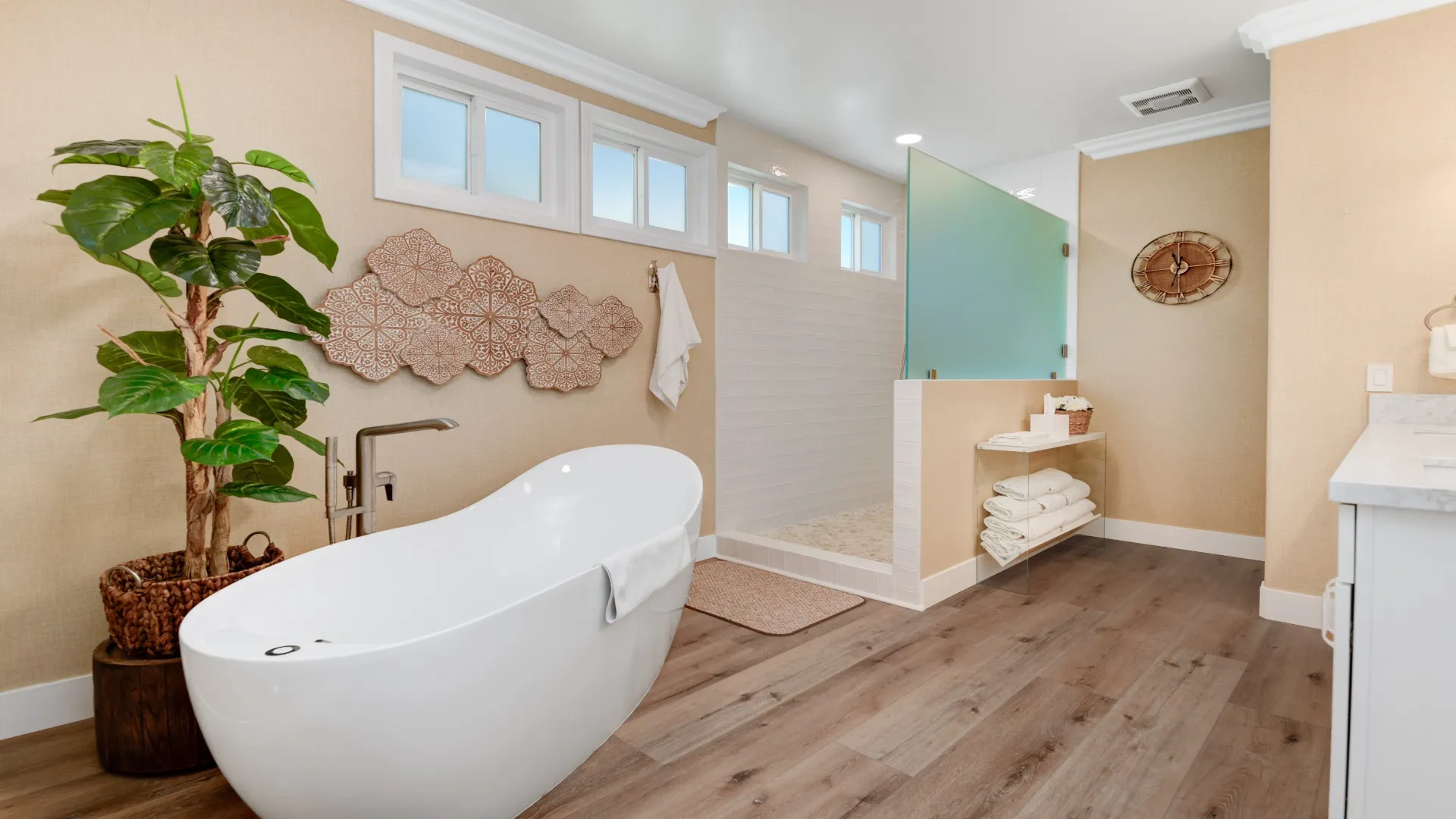 Primary bathroom with a freestanding tub and open walk-in shower