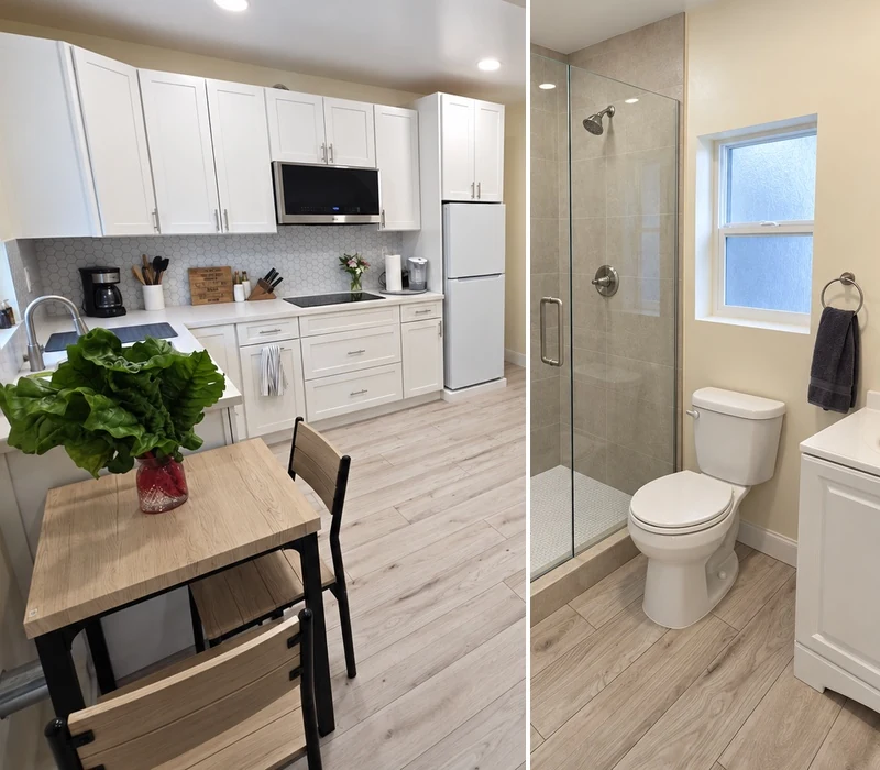 Converted garage with a white kitchen and a walk-in shower
