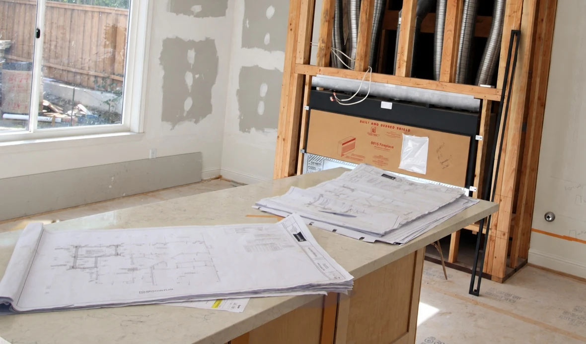 House plans on a counter during construction