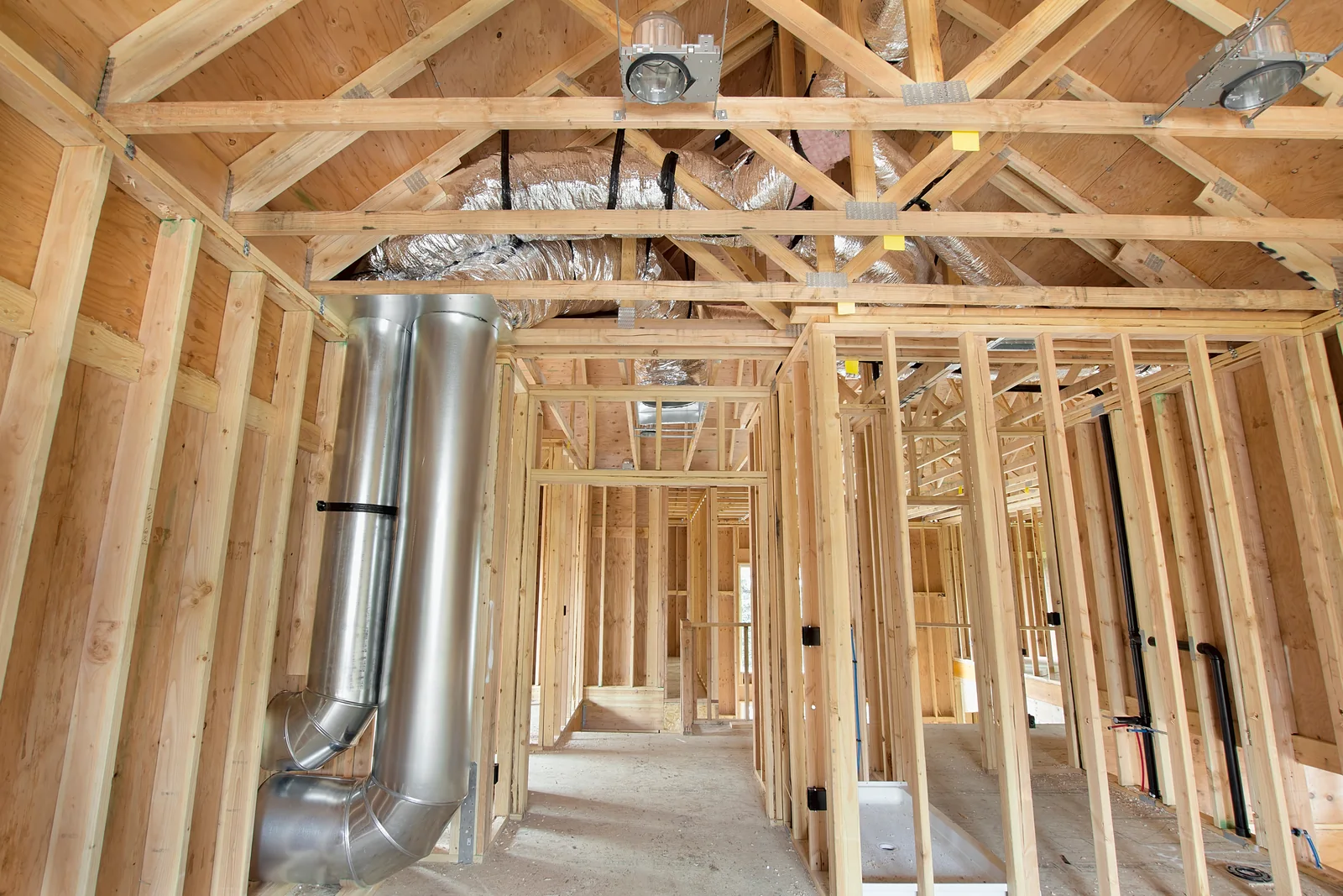 Framed walls with ductwork and electrical rough-in