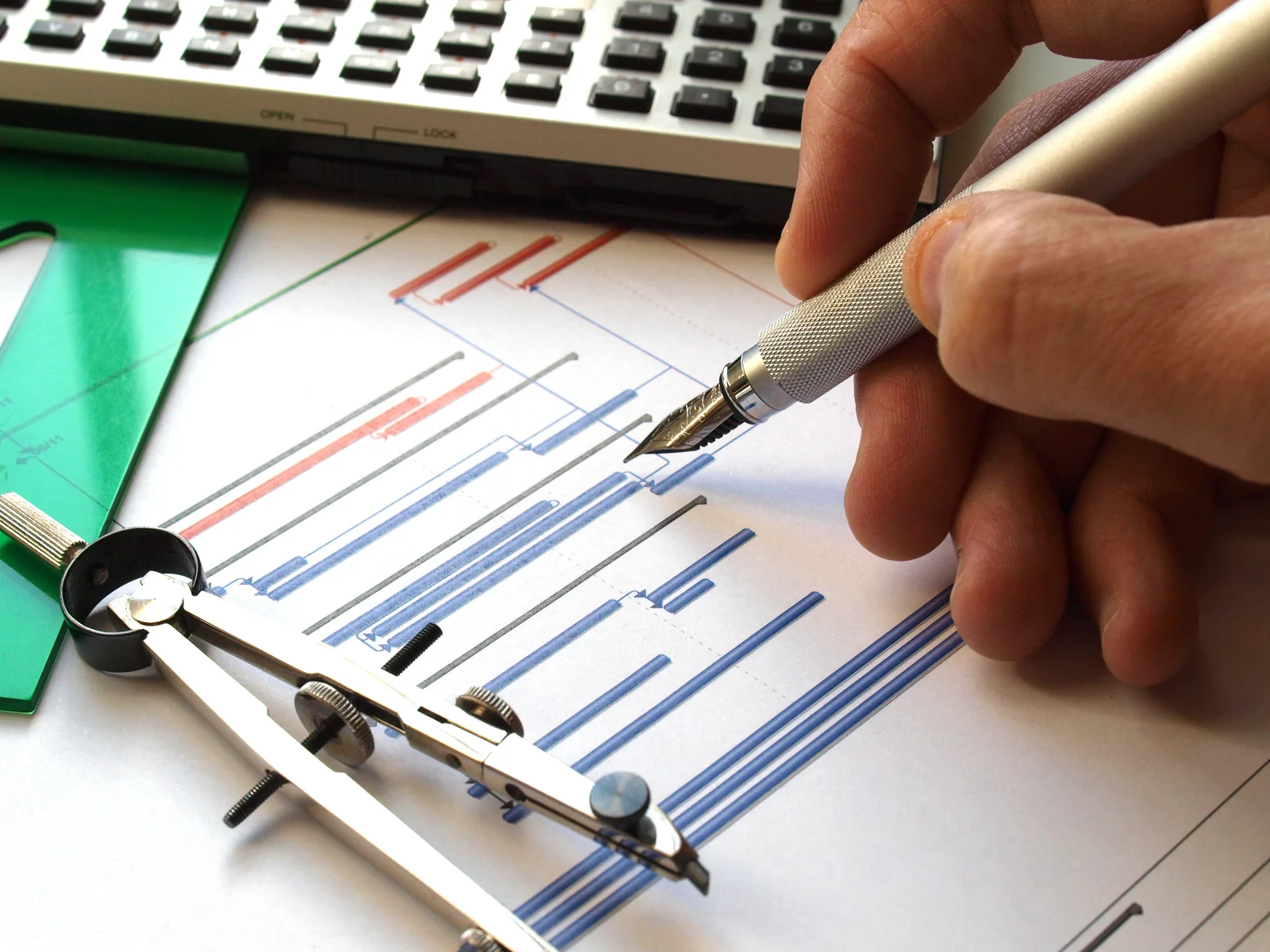 Hand drawing a project schedule with drafting tools