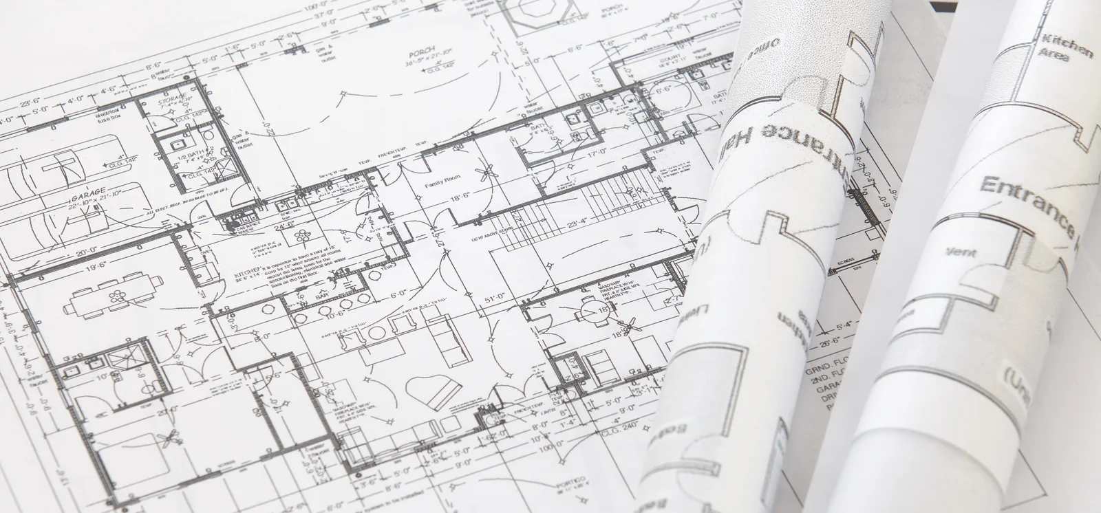 House plans rolled out on a table