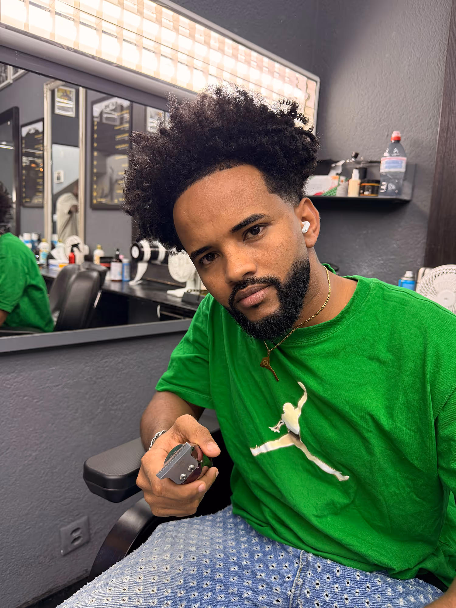 Barakay, a barber at Fineboy Barbershop