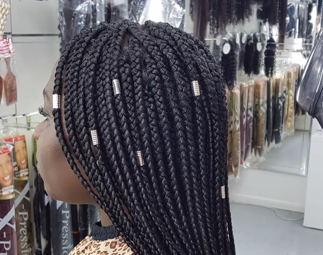 Long braided hairstyle at Fineboy Barbershop Bern