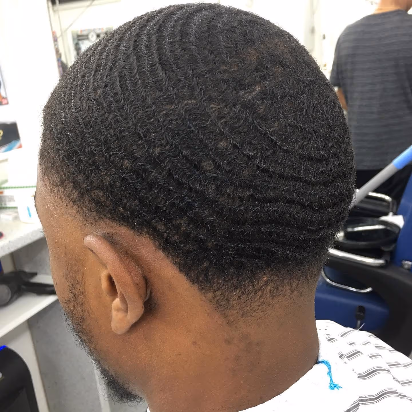 Taper fade with waves haircut