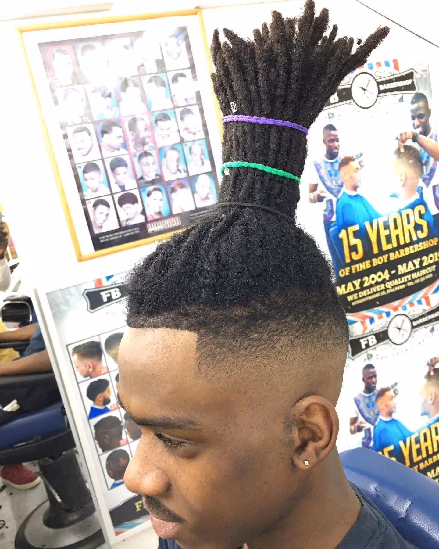 Clean fade with styled dreadlocks at Fineboy Barbershop Bern