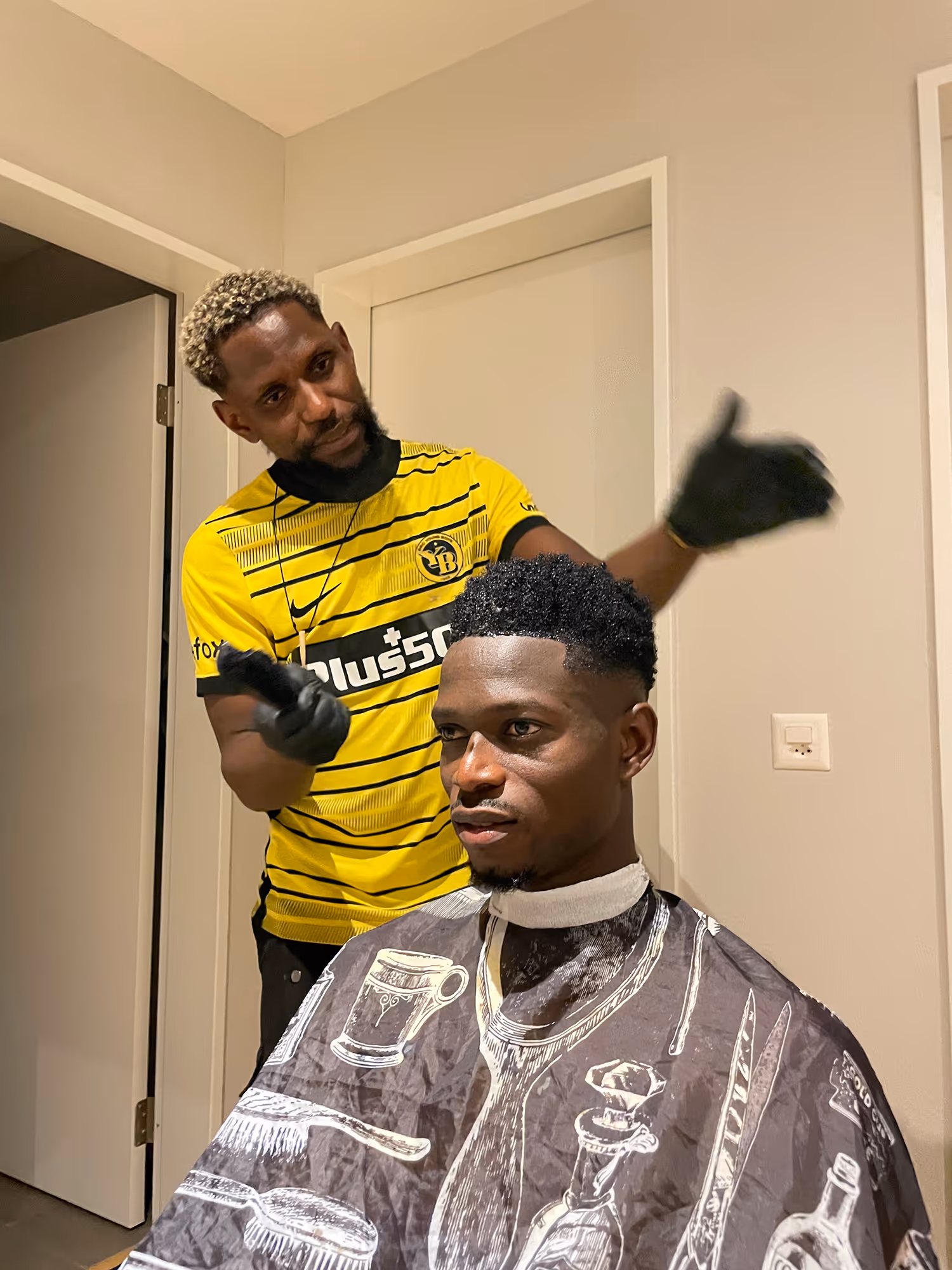 Young Boys team athlete grooming at home before Champions League game