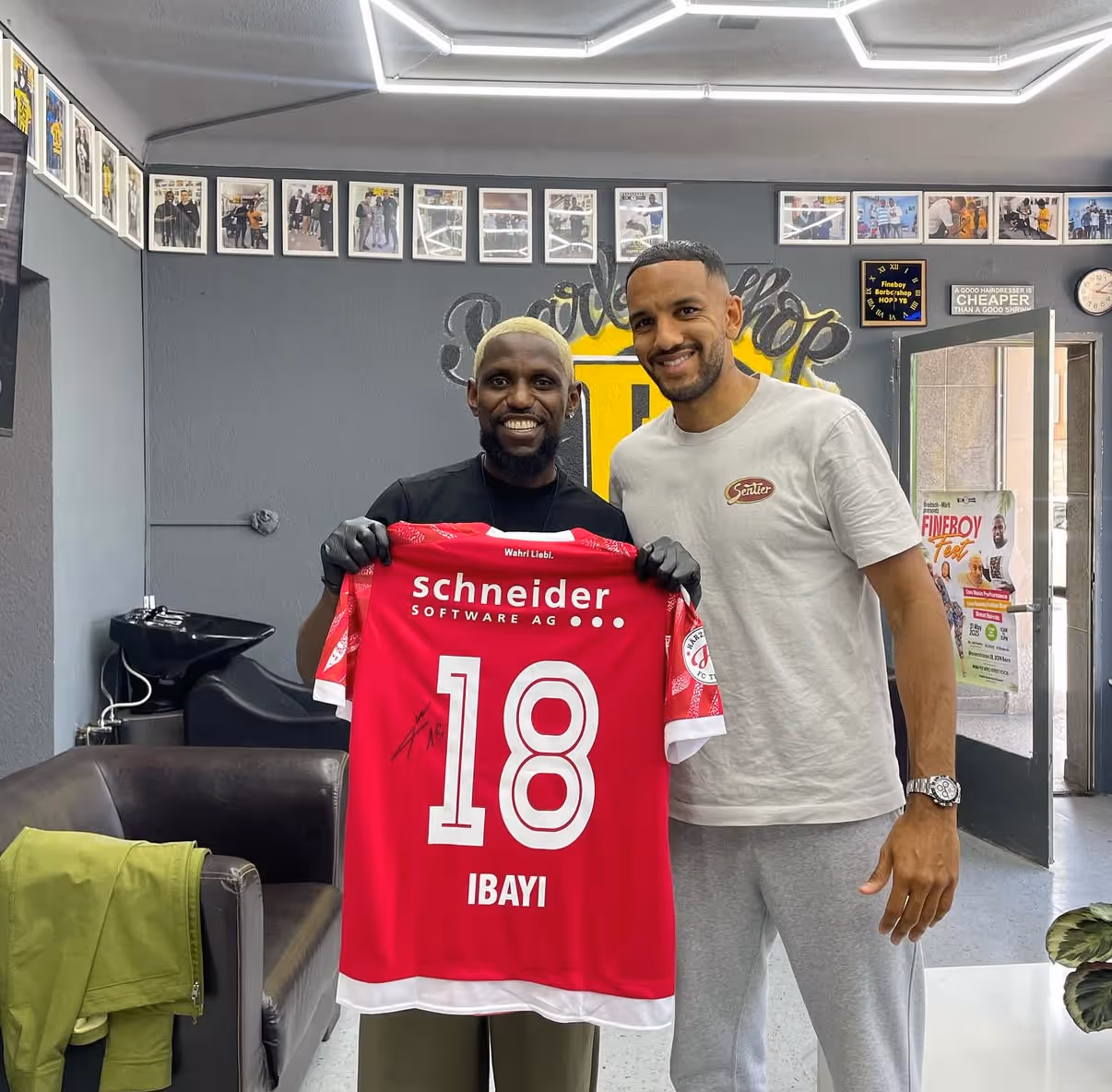 Professional football player visiting Fineboy Barbershop for a fresh haircut