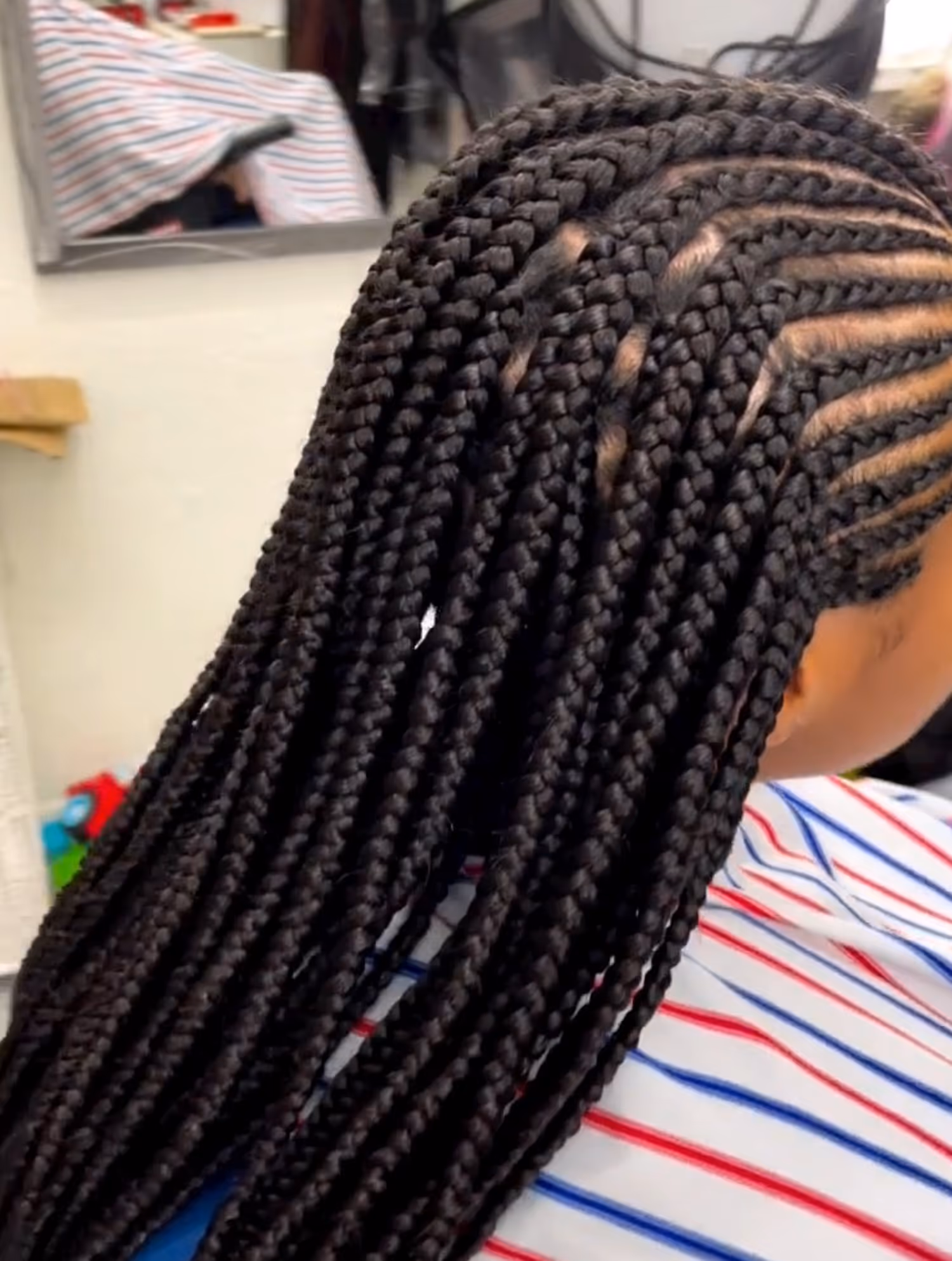 Women’s braided look at Fineboy Barbershop Bern