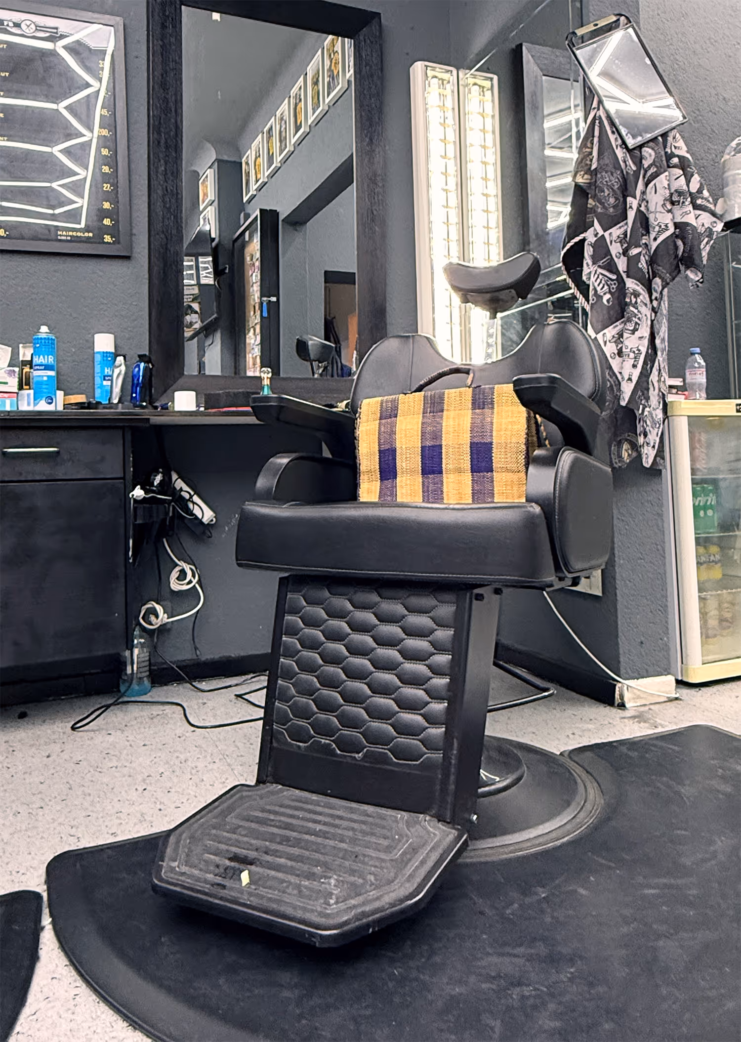 Fineboy his chair where he cuts his clients