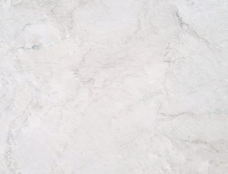White and cream quartzite slab with soft veining