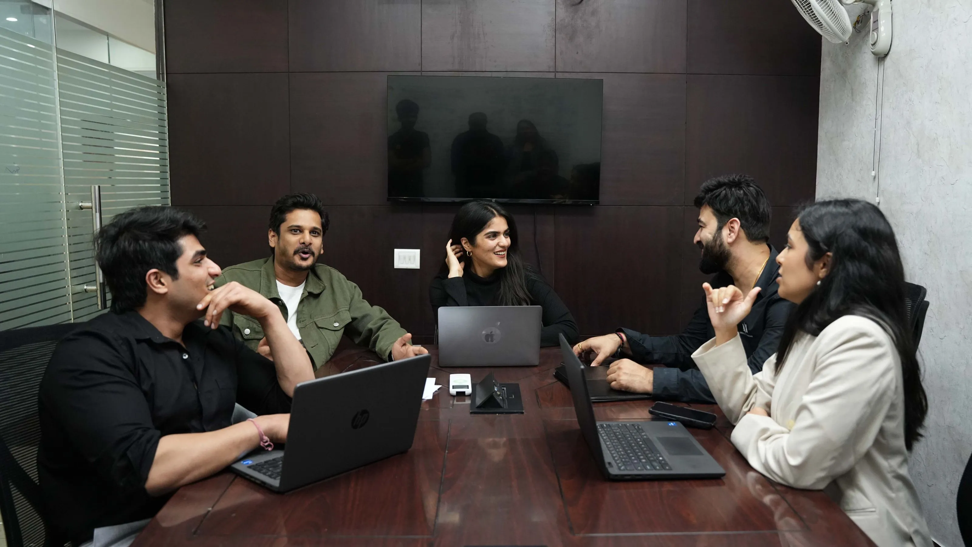 Team members having discussion regarding UK project