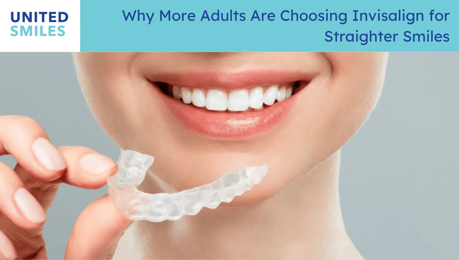 Woman holding a clear Invisalign aligner in front of her smile