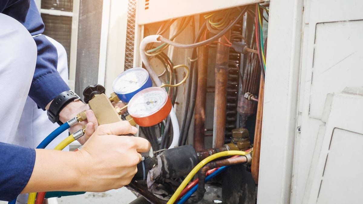 A technician working on a commercial heating system in Plano, TX.