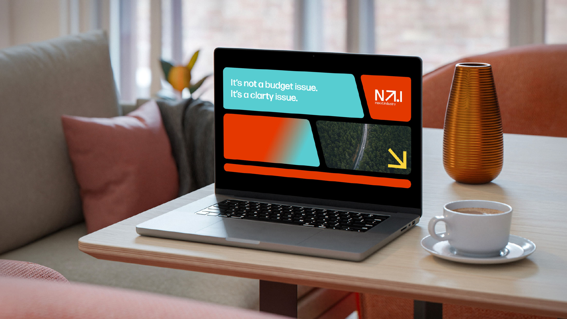 Laptop showing “It’s not a budget issue. It’s a clarity issue.” on a Nexxt Industry blog page