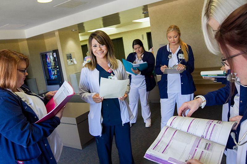 A Baptist Health employee team meeting in a hospital