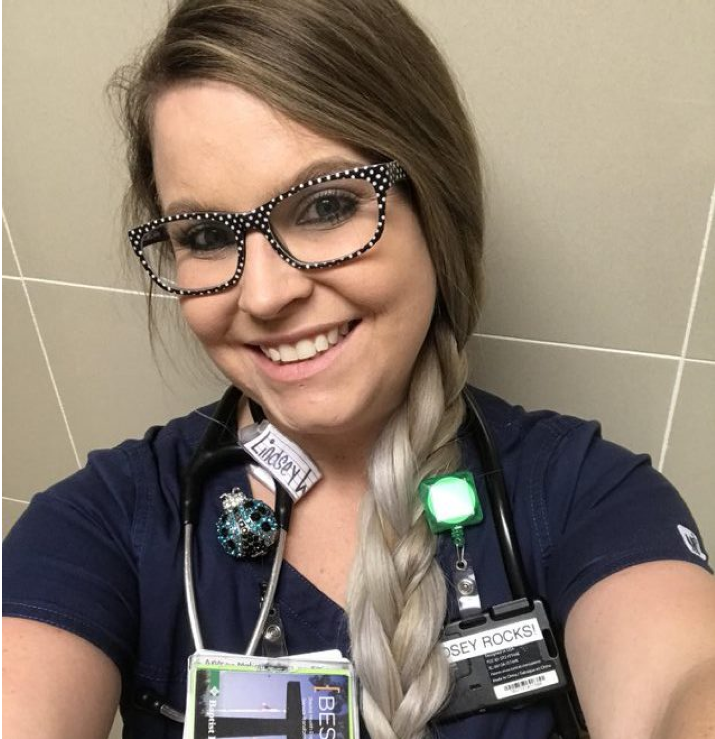 A Baptist Health Career professional smiling taking a selfie in a hospital environment