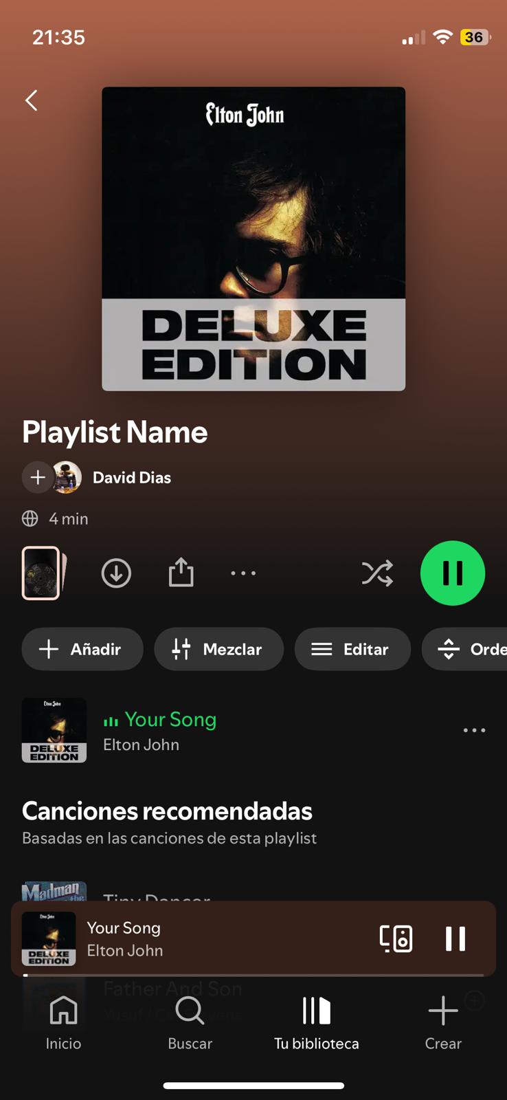 Spotify playlist screen showing Elton John's Deluxe Edition album playing 'Your Song' by David Dias.