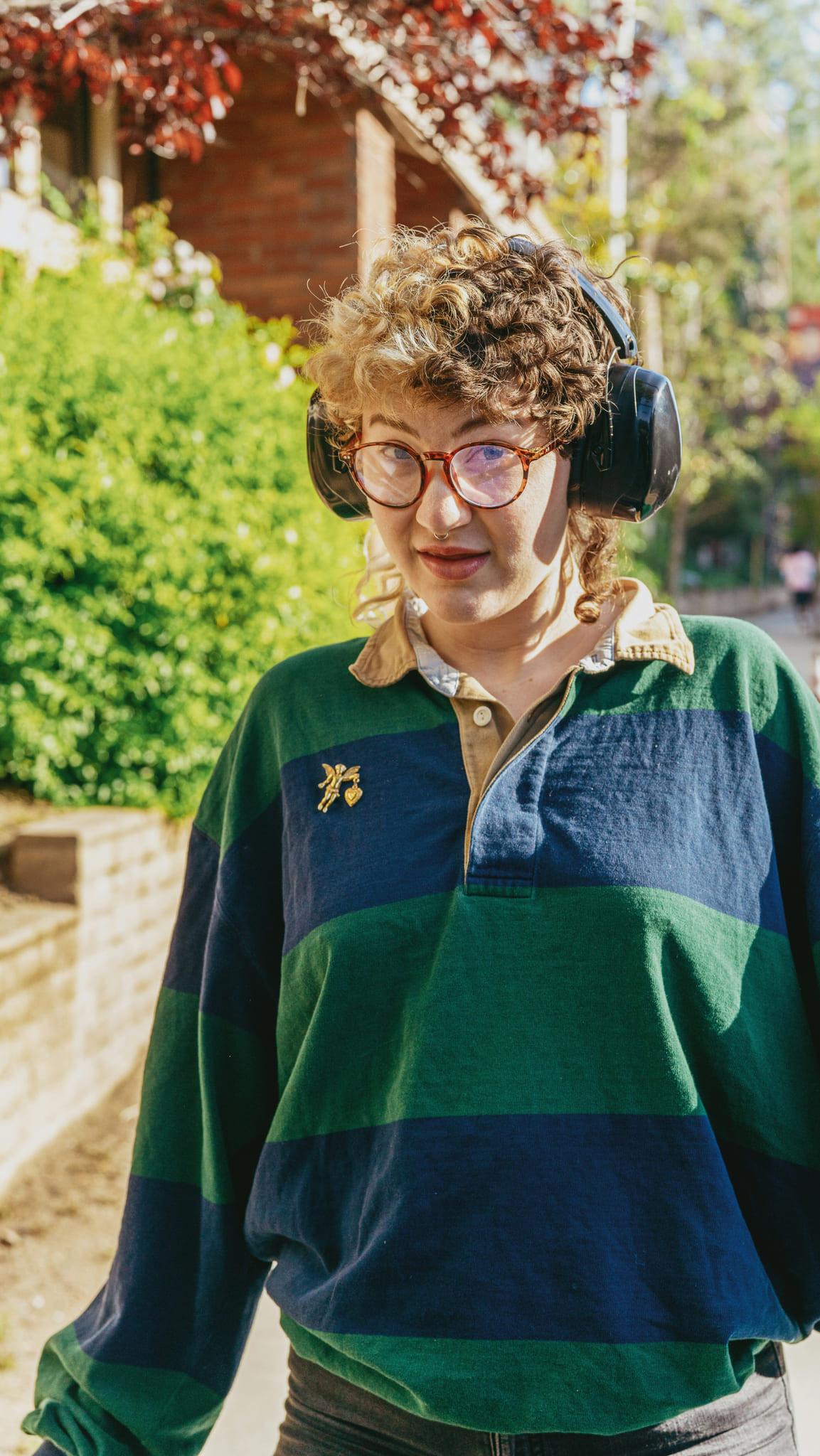 A woman listens to music with headphones on