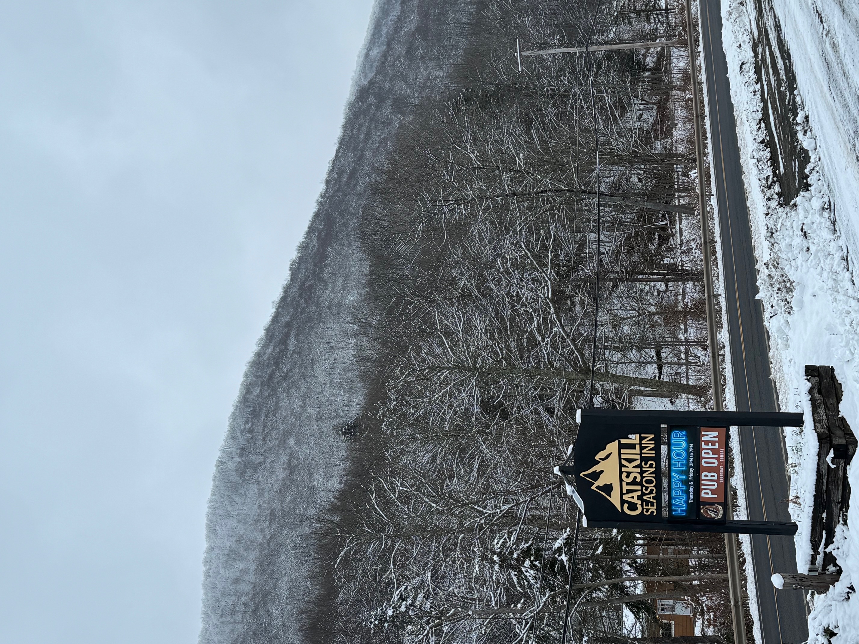 A wooden entryway with a staircase