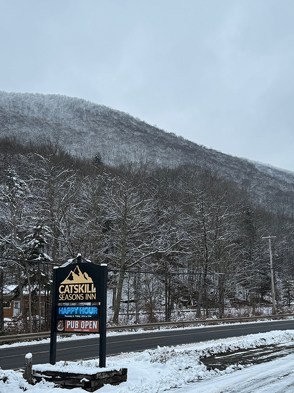 A wooden entryway with a staircase